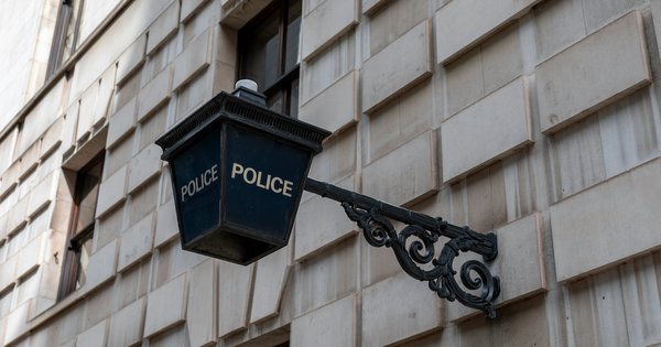 Police sign on building